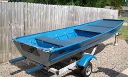 Sturdy 14'John boat. Lots of storage. Large rear seat compartment. Does not Leak!