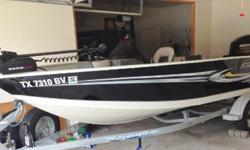 Purchased new in 2013, less than 50 hours. Garage stored, original owner. VIN STR26829K011. 2013 Mercury 60 outboard motor four cycle; model 60ELPT; upgraded stainless steel prop with spare prop. Console on starboard side with windshield. 17 gal petrol