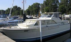 (LOCATION: Port Huron, Michigan) The Chris Craft 42 Commander has classic style that is still copied today. Here is your chance to own an original &nbsp;MacKerer design at a fraction of the cost of new. Expanded and enclosed bridge, open salon, full