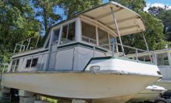 Fiberglass Trailerable Houseboat
Spacious houseboat with cuddy under salon. Will sleeps 6. Powered by a v-8 Chrysler Dana outdrive and Kohler generator both need recommisioning (seasonal service after being in storage / complete check out and tune up).