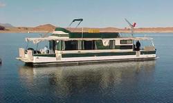 PRICE JUST REDUCED TO $14,995!
Located at Bullfrog, Lake Powell, Utah.
HOUSEBOAT HAS ONLY BEEN IN FRESH WATER!
Steel pontoons pressure checked & painted, spring 2001;
Twin MerCruiser straight-6 stern drives;
Westerbeke 5.0 kw generator, new in 6/01, aprx