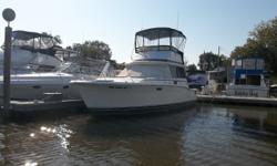 This 1979 Trojan F32 flying bridge is powered by Twin 360 FWC Chryslers. Features include: a 31 inch flat screen TV with DVD player, new bimini top with full enclosure, GPS, VHF, stereo, microwave, dockside power, new carpet, enclosed head with shower,