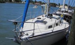 AccommodationsThe main salon is spacious and bright and looks great! There are settees with sea berths to port and starboard; the upholstery is in excellent condition. Forward of the port settee is a storage unit and the folding table is mounted on the