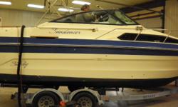 HERE IN STORAGE FOR REVIEW, NO TRAILER, BOAT ONLY. LOWRANCE DEPTH FINDER, SPARE PROP,, EXTRA KEYS INCLUDED, SOME WARRANTY INCLUDED, LOADS OF STD EQUIPMENT, 2 tone hull, stainless bow rail, full swim platform w/ladder, forward anchor locker hatch, teak