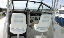 This 1988 Pro-Line WA is 25 feet in length. Powered by twin Suzuki 4 stroke 225 HP outboard motors, DT225. The Starboard lower unit is visibly cracked, Includes Fast Load tri-axle trailer. Boat is being sold "as is". Financing and delivery available upon