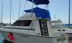 A rare feature is the island pedestal bed forward.&nbsp; Aft starboard is full galley and to port is the head and shower. The main salon is large with convertible lounge settee. Sliding glass doors open up to aft deck with stair access to enclosed fly