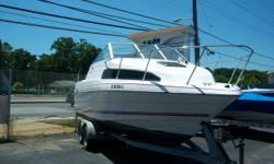 This 1993 Bayliner 2252 is powered by a V6 Mercruiser. Features include: enclosed head, cockpit cover, trim tabs, dual swim ladders, new lower unit, sink, ice box. Nice clean, older boat and the package includes a free dual axel trailer. Our low, shop