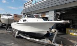 This 1993 Celebrity 23 Fishawk walk around cuddy is powered by a 260hp fresh water cooled Mercruiser (new in 2005). Features include: dual batteries, porta pot, depth finder, trim tabs, swim platform, bow pulpit> She's a very clean and well maintained