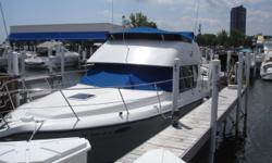 One of Carver's most popular models. Packs a lot of living in a 35' boat. Two private staterooms and two heads, makes it great for a family or a couple who travels with friends. Has the optional lower helm. Trades considered. CANVAS BIMINI TOP (BLUE)