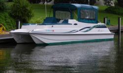 This 1996 Regal Leisure Cat 26 Side Console is great for family cruising. The catamaran style provides extra stability and the Mercury 225 Offshore is perfect for getting her up to speed. She only has 96 hours and is turn key ready to go! Features include