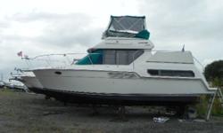 This Carver Aft Cabin has a nice set up with vee berth/dinette forward, aft cabin with double and single berth, sofa bed, and head/shower combo. The wrap around windows make the interior look bigger than it is. The aft cabin has a sink and vanity. The