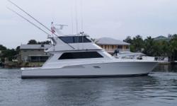 Vessel Walkthrough
The salon features a large L-shaped sofa and teak high/low coffee table to port. To starboard is a barrel chair and teak cabinetry. Forward are two leather swivel stools at the galley counter. Step up and the galley is to port with a 6