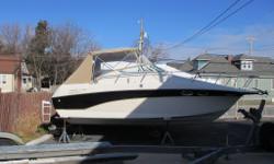 This 1997 Crownline 250 Cruiser is powered by a 230hp Mercruiser with Bravo 3 outdrive. Features include: dual batteries, dockside power, enclosed head, pressure water, hot water heater, shower off of the swim platform, brand new full enclosure canvas,