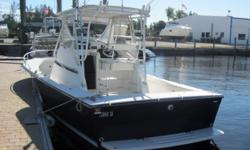 The Blackin 27 is a sleek, heavily built center console geared toward fishing rough, offshore waters. The Blackfin features a large, open cockpit with in-deck fish boxes, live well, and transom fish box. With her rugged deep vee hull bottom, combined with