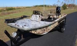 1997 Carolina Skiff 165,
Fiberglass camo boat with new carpet, everything updated and replaced in 2012 including. New 2009 Mercury 30 Hp EFI 4 stroke motor with tilt and trim, new Eagle Cuda 300 graph, Minnkota Edge hand control 45 lb. thrust 12 lb.