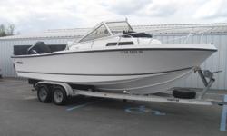 1998 Mako 223 Walkaround Cuddy powered by a 2002 Mercury 225 XL EFI outboard engine with 244 hours. Seating includes: (2) captains seats, bow cushion seating, bolster leaning cushions, and (2) back seats. Options include: Humminbird VHF radio, trim tabs,