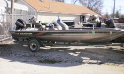 1998 Tracker Pro Team 185 on a Tracker trailer with a 2002 40hp Mercury outboard. The boat has a built in fuel tank, rear deck with livwell and storage, under seat storage box, dual rod lockers and front deck with storage boxes. It has a dual consoles,