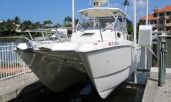 1999, 26' WORLD CAT 266 SC (Sport Cabin) with Hard TopPrice: $33,500 - Location: Naples, FloridaYou will find this 1999, WORLD CAT 266 Sport Cuddy to be a perfect all around boat for fishing, cruising, beaching, over night get-aways, or just heading out