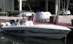 This immaculate well maintained Scarab Sport was built for speed. Twin 225 Evenrude's with low hours top out at over 50 knots. Loaded with electronics and lots of extras. Fishing goodies include a large transom fishbox, duel leaning post with 40-gallon