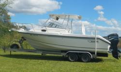 2000 Boston Whaler Conquest 23 Cuddy Cabin. Twin Mercury 135 Optimax Saltwater series. 2005 Magic Tilt tandem axel aluminum trailer. Package includes T-top, stainless steel props, 2 NEW batteries (Nov 2016), hydraulic steering, port-o-potti, Above deck 30