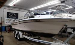 Fish Lake Erie on this 22-foot Grady-White! Equipped with ample rod holders and storage, livewell, and a fish box. The small cabin allows for time out of the sun and offers the comfort of a head. This is the perfect trailerable boat for you and your