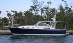 Accommodations
This fully customized Downeast Cruiser sleeps 4. The Master Stateroom sleeps 2 and the Salon settee converts to sleep 2. She features solid cherrywood interior and teak and holly sole through out. The large table is for the salon and the