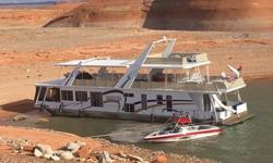 THIS IS A 1/10th SHARE MULTI-OWNER HOUSEBOAT.
ONLY 7 INDIVIDUALS OWN THIS HOUSEBOAT!
LOCATED IN A COVERED SLIP AT BULLFROG, LAKE POWELL, UTAH.
Twin MerCruiser 5.7L EFI 270 hp engines
Twin Bravo II sterndrives
Halon
(3) Fire extinguishers
Inverter
Aluminum