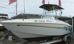 2003 BAJA 25' SPORTFISH CENTER CONSOLE. Powered by a 250 hp Mercury outboard with only 225 hrs. This boat is super clean and includes Tee Top, GPS, Stereo, Livewell, Rodholders, Washdown, Trim tabs, Flip down rear seating, Porta potti enclosure, Front