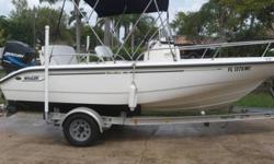 This is a 2003 Boston Whaler 18' Dauntless. It comes with all Coast Guard needed equipment, a VHS Radio, GPS, Compass, Anchor, Ski Tow Rig and Bow Attached Fishing Seat. The engine has around 160 hours on it. Also included is a 2003 Magic Tilt trailer.