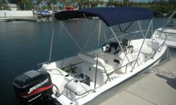 Looking for a small affordable fishing boat that doubles as a family cruiser? The 2004 Boston Whaler 160 Dauntless is quite a bargain. She may be small but she's got some really nice features including a sturdy blue bimini top, rod & tackle storage, and