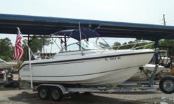 Well maintained and ready to go, this 2004 Boston Whaler 210 Ventura is just another fine example of the Boston Whaler brand. With its excellent use of deck space by including a fold away bench seat at the stern, to the bow seating with storage