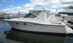 Description
This low hour 3200 Tiara Open is "Our Trade" and ready to fish dive or cruise. Nicely equipped with LOADS of Tiara options she won't last long!!
Salon
Fiberglass companionway steps with teak hardwood tread and hinged storage compartments