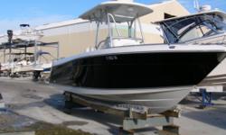 INTRODUCTION: This Robalo R260 is turn key and ready to fish with an engine warranty good through mid 2012. Items of note are a built-in prep station, bait well, cavernous under deck fish storage and recessed rod lockers on port and starboard sides.