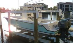 This 2006 Contender 27 Open Center Console has been very well-maintained and kept in pristine condition! The boat is very clean and stored on a lift with a full canvas cover. She's equipped with twin Yamaha 2-stroke HPDI's with 560 hours. The Furuno