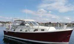 The 2006 Mainship 30 Pilot II has a very classic look but this beauty is also equipped with some excellent modern features. The red mahogany hull against the blue of the ocean is simply beautiful and her cabin is equally luxurious. The hull design along