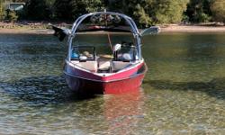 2006 Malibu VLX 23 Feet Long 385 Miles On The Engine Great Condition Fiberglass Hull Material Burgundy Exterior With A White Interior Single Axle Trailer 340 Horse Power Master Craft Engine Trolling Motor Located in Calgary AB. Financing Nationwide