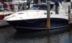 (LOCATION: Hollywood FL) The Sea Ray 320 Sundancer is a popular and practical family cruiser with a large open cockpit with ample seating and a spacious mid-cabin interior. This good-looking express with dark blue hull, white top side, and blue bimini