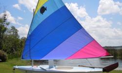 2007 Sunfish (light blue stripe) with trailer and sunfish dolly.&nbsp; Multi colored sail in good condition with custom sail bag.&nbsp; FRP daggerboard with padded storage bag and traditional wooden rudder assembly.&nbsp; The ultimate beach boat!!&nbsp;