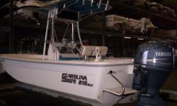 In Pensacola, FL. This Carolina skiff has been serviced and dry stored here at Harbor View Marine. It&nbsp;is ready to fish the bays. Features and options include: Canvas T-Top w/ 4 Rocket Launchers, Electronics&nbsp;Box, Flip Flop Cooler Seat,