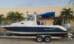 The 26 XP is a professional grade Pilot house fishing boat with versatility and quality.
The helm is open airy and protective in any weather situation. The fiberglass hard top and wind screen are stout for any condition. This top is great in hot weather