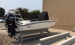 This boat has spent its entire life in rack storage. Taken down only to clean and use briefly. less than 20 hours. Plenty of power with the Mercury 200HP Verado Four Stroke. Well-equipped with the "Activity Tower" which includes never used wake board