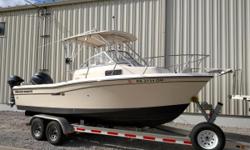 Rigged and ready to fish, this 20-foot Grady-White is the perfect walkaround style with a solid ride! The hardtop is rigged with multiple rod holders, spreader lights and has a mounted electronics box. An open aft deck allows for plenty of room for