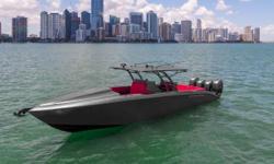 This 2014 Midnight Express 39' Cuddy powered with quad Mercury 300hp Verados will be sure to turn heads. Her stealth hull color and inspired Lamborghini red diamond stiching upholstery gives you the feel of an exotic car on the water. She has always been