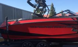 This 2014 Nautique G23 red beauty is gorgeous inside and out. Throws the best wakeboard and wakesurf waves in the industry. Red and black color combo this boat has heads turning. Loaded with the PCM XR550 engine, 4 Roswell tower speakers, NSS-Nautique
