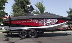 This 2015 red metal flake and black Super Air Nautique G23 is turning heads on and off the water. Nicely loaded with almost every option Nautique offered in 2015. Some of the cool options are the tower speakers, bimini with surf pockets, cinch cover, bow