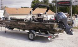 2015 SeaArk VFX2072 boat on a Marine Master trailer with a F115 Yamaha outboard. The boat has upgrades that include Break-Up camo. Gatorhide liner, external floatation pods with ss ladder, rear bench livwell, 2 deluxe captain seats with sliders, stereo