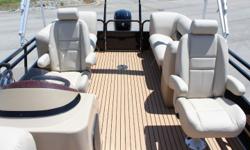 253 Tritoon! Special on this boat.
Black with upgraded black rails, tan SE interior package and beige teak floor covering. Loaded with: split rear loungers, dual captains chairs, upgraded helm station with built in Lowrance HDS-5 GPS system, BLUE LED