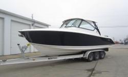 Recently traded in on a larger Pursuit, this 295 Dual Console has been very gently used and has only 25 hours on the Twin 300hp Yamahas! Convertible cockpit seating offers ample room for entertaining or can be tucked away to make room for fishing. Fishing