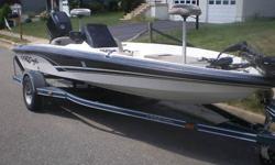 Fiberglass bass boat is white with green striping. The boat measures 17 feet in length, 84 inch beam powered by a Mercury 90 HP ELPTO with stainless steel prop (Apollo by Michigan Wheel). With a medium load and two anglers, this boat with will travel