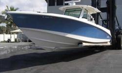 2010 Boston Whaler 37 OUTRAGE Kept in Enclosed Storage since New. ABACO BLUE Imron Hull Sides with ( Triple ) Mercury 300 Verado's. Dual 14" Raymarine E-140 Wide Screen GPS/Chartplotter with 48" Open Array Radar with Satellite Weather. White Hardtop with